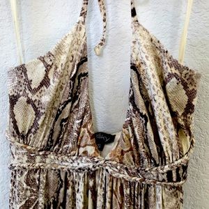 Sky snake skin dress with 2 cutouts on lower half, shows skin through lace